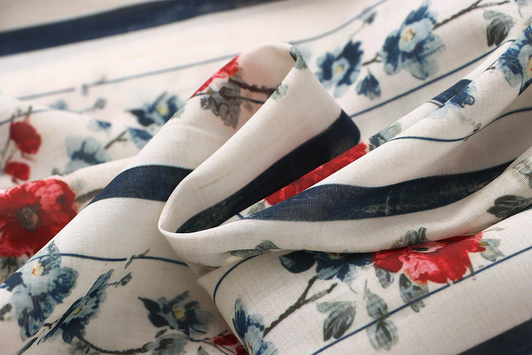 Malbusaat floral striped fabric closeup showing cream background with red and blue flowers for loose straight wide pants for women