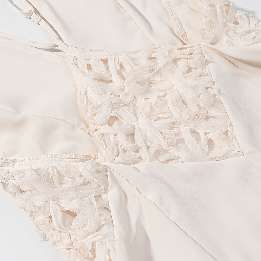 Close-up of elegant lace maxi dress in cream with delicate floral lace detailing by Malbusaat