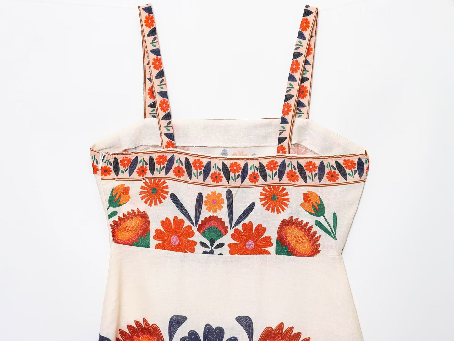 Malbusaat Floral Spaghetti Strap Slim Fit Maxi with vibrant orange and green floral embroidery on cream fabric