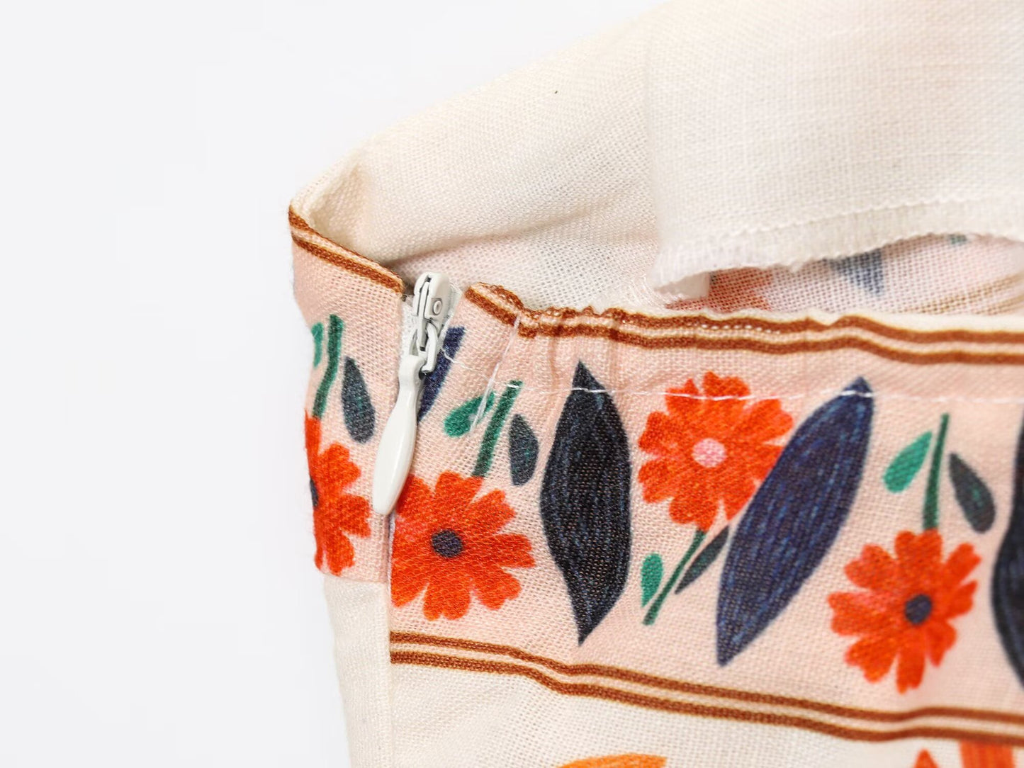 Close-up of floral print detail and zipper on Malbusaat Floral Spaghetti Strap Slim Fit Maxi dress