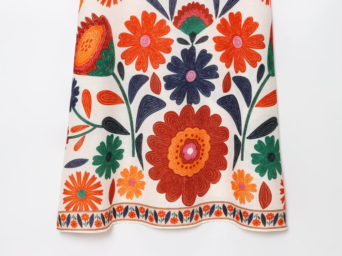 Floral Spaghetti Strap Slim Fit Maxi dress with vibrant orange green and purple flower print by Malbusaat