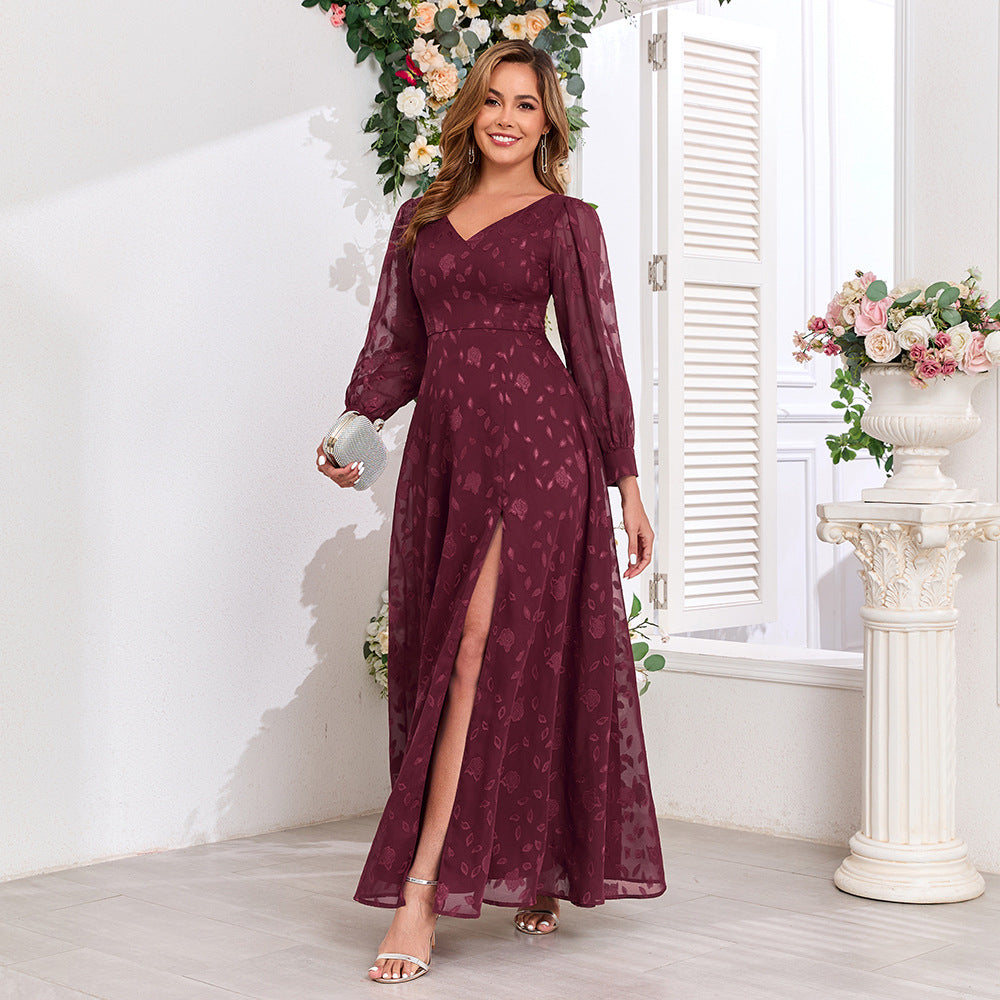 Malbusaat lace maxi dress with high slit in deep burgundy featuring long sleeves and a V-neckline