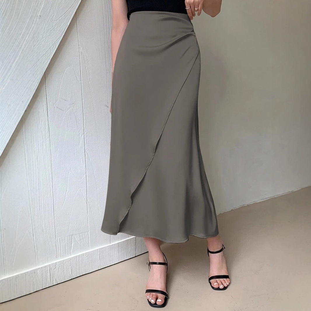 Olive green satin midi skirt for women with wrap design paired with black sleeveless top and black heels