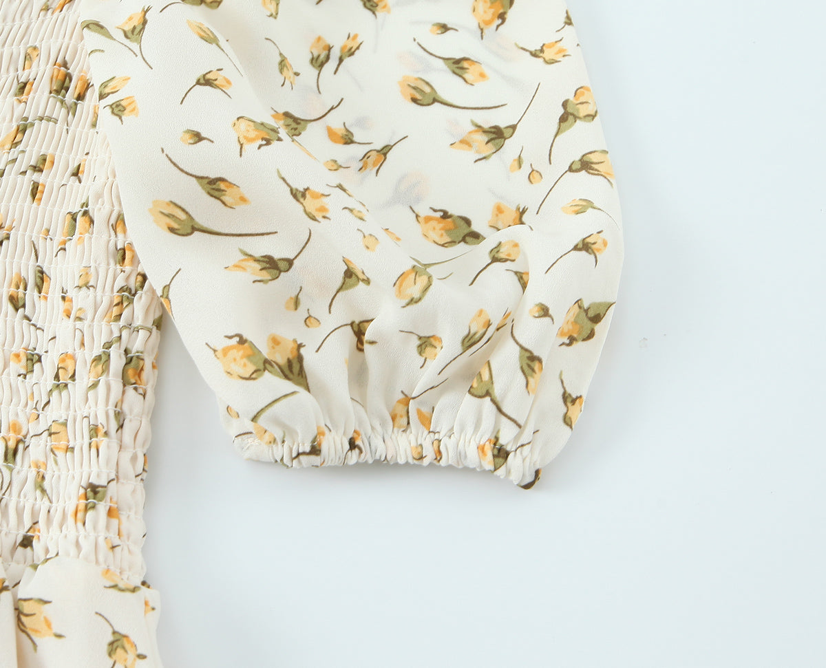 Close-up of yellow floral pattern and puff sleeve on summer floral puff sleeve dress by Malbusaat