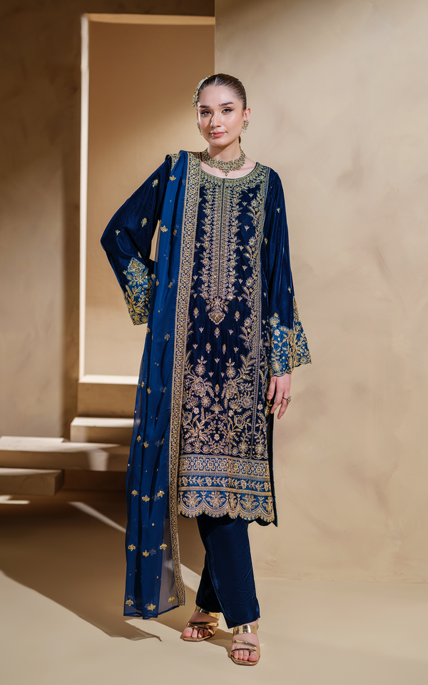 Midnight blue velvet Pakistani suit with intricate gold embroidery and elegant design details