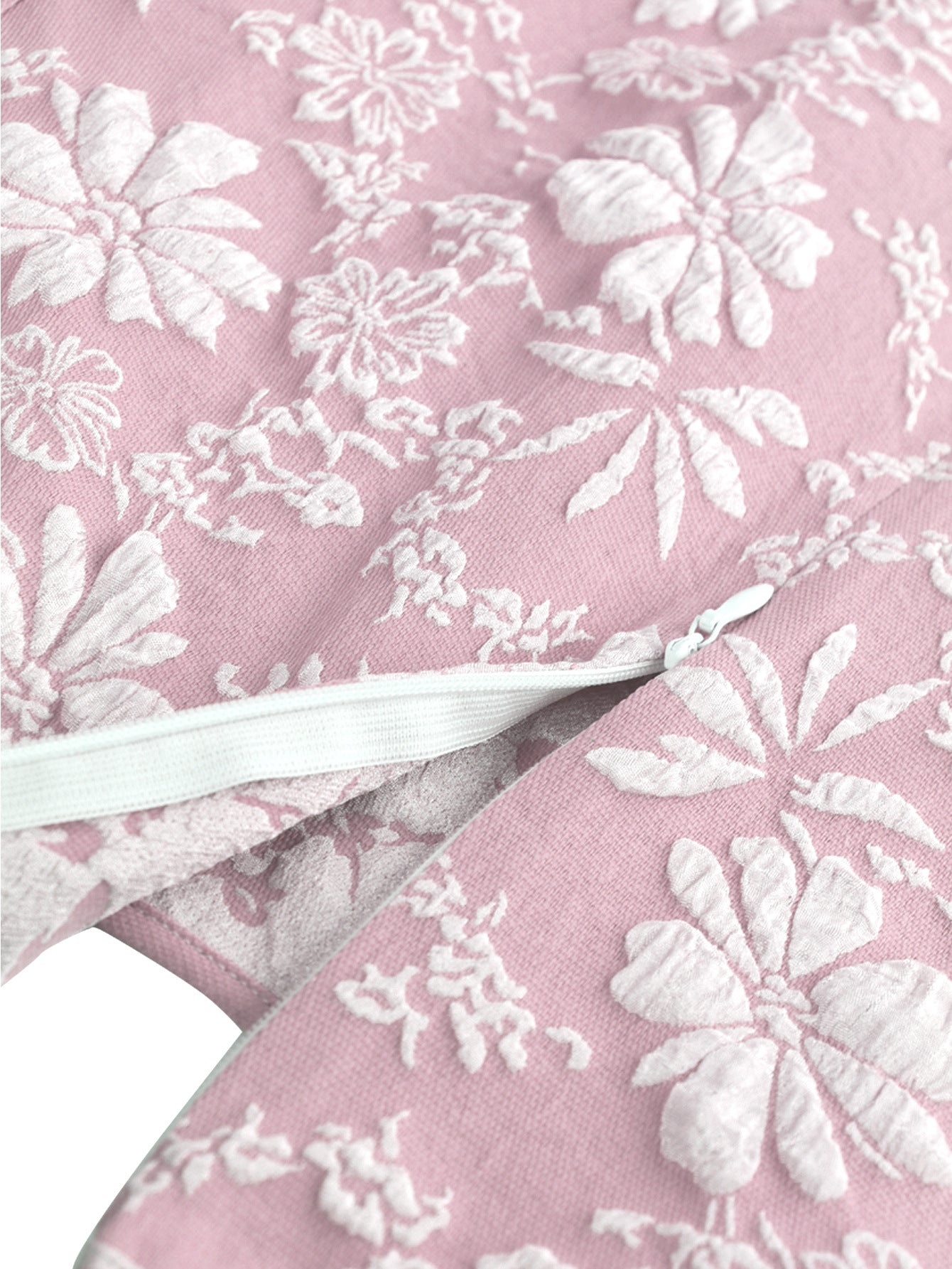 Close-up of pink fabric with white floral embroidery detail on Malbusaat fishtail bodycon dress