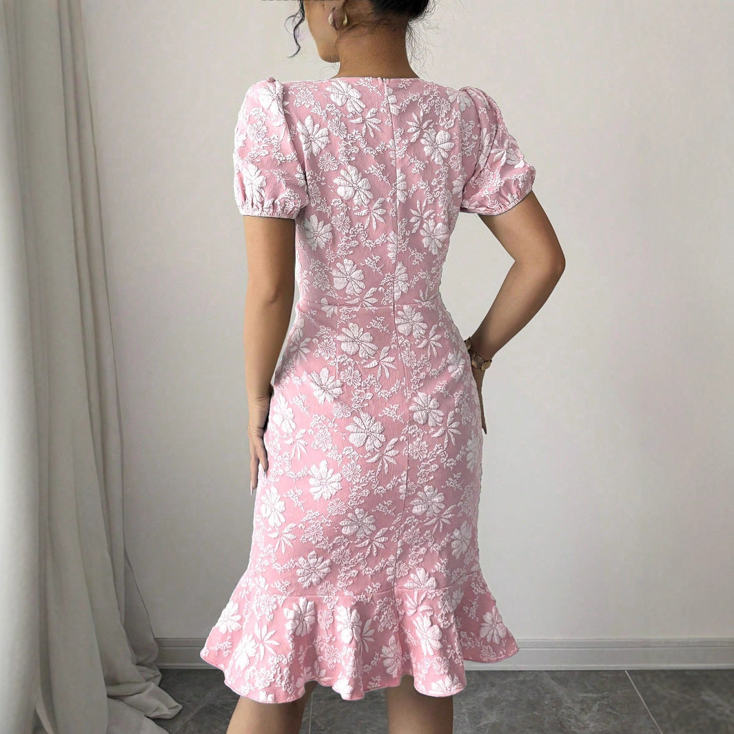 Back view of pink and white floral fishtail bodycon dress with puff sleeves from Malbusaat