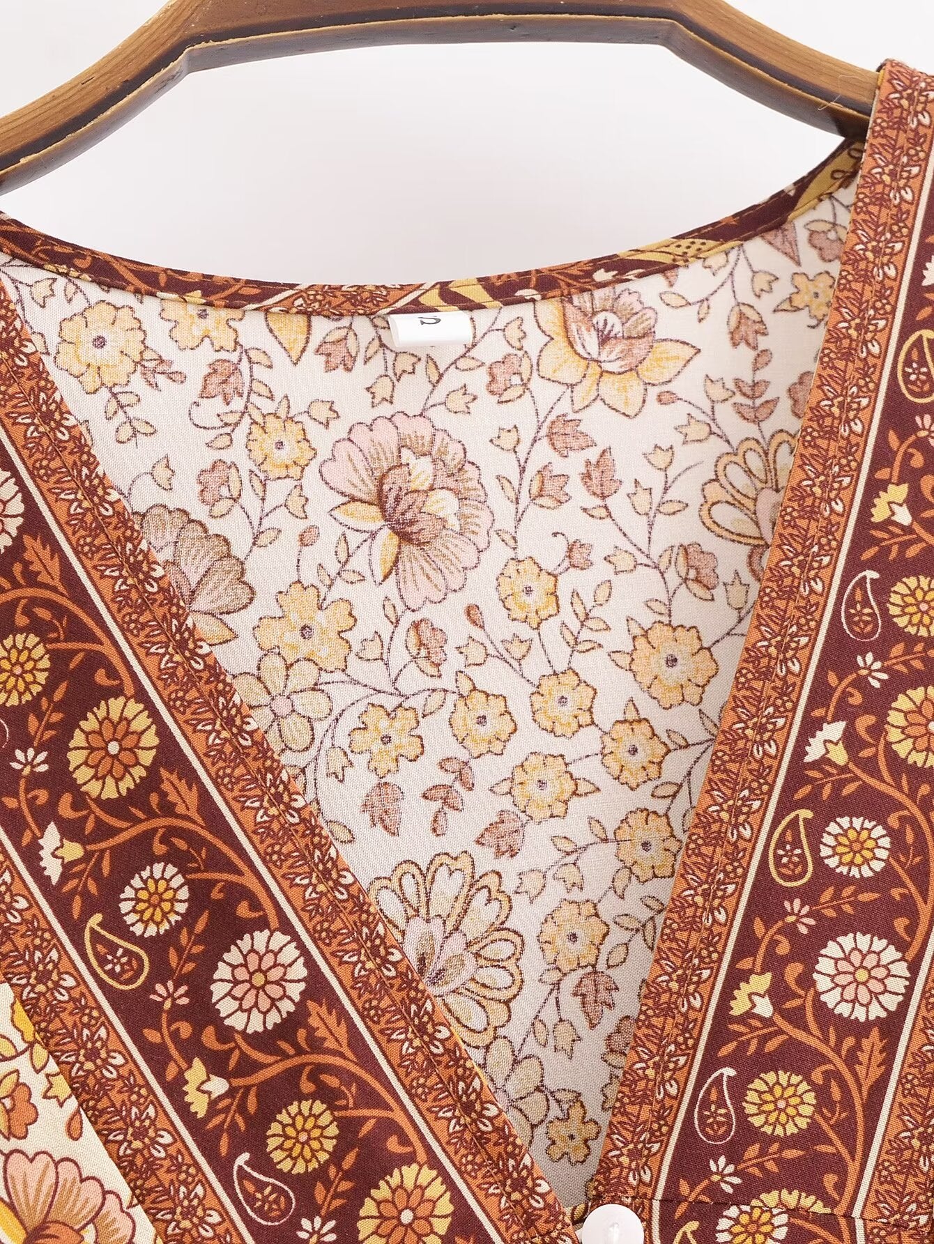 Close-up of Malbusaat printed rayon maxi dress for women featuring floral patterns and button detail