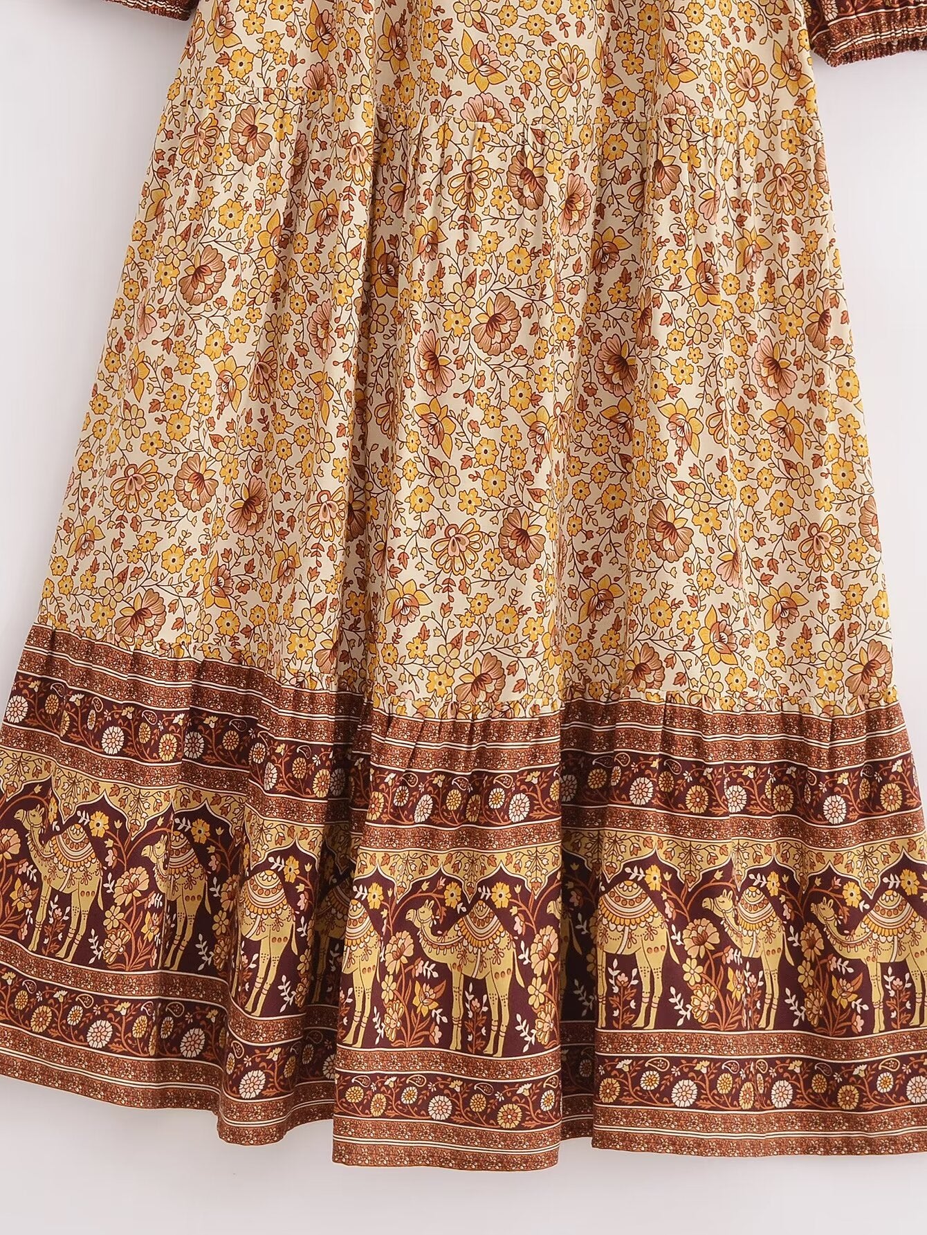 Malbusaat printed rayon maxi dress for women featuring intricate floral and elephant border design