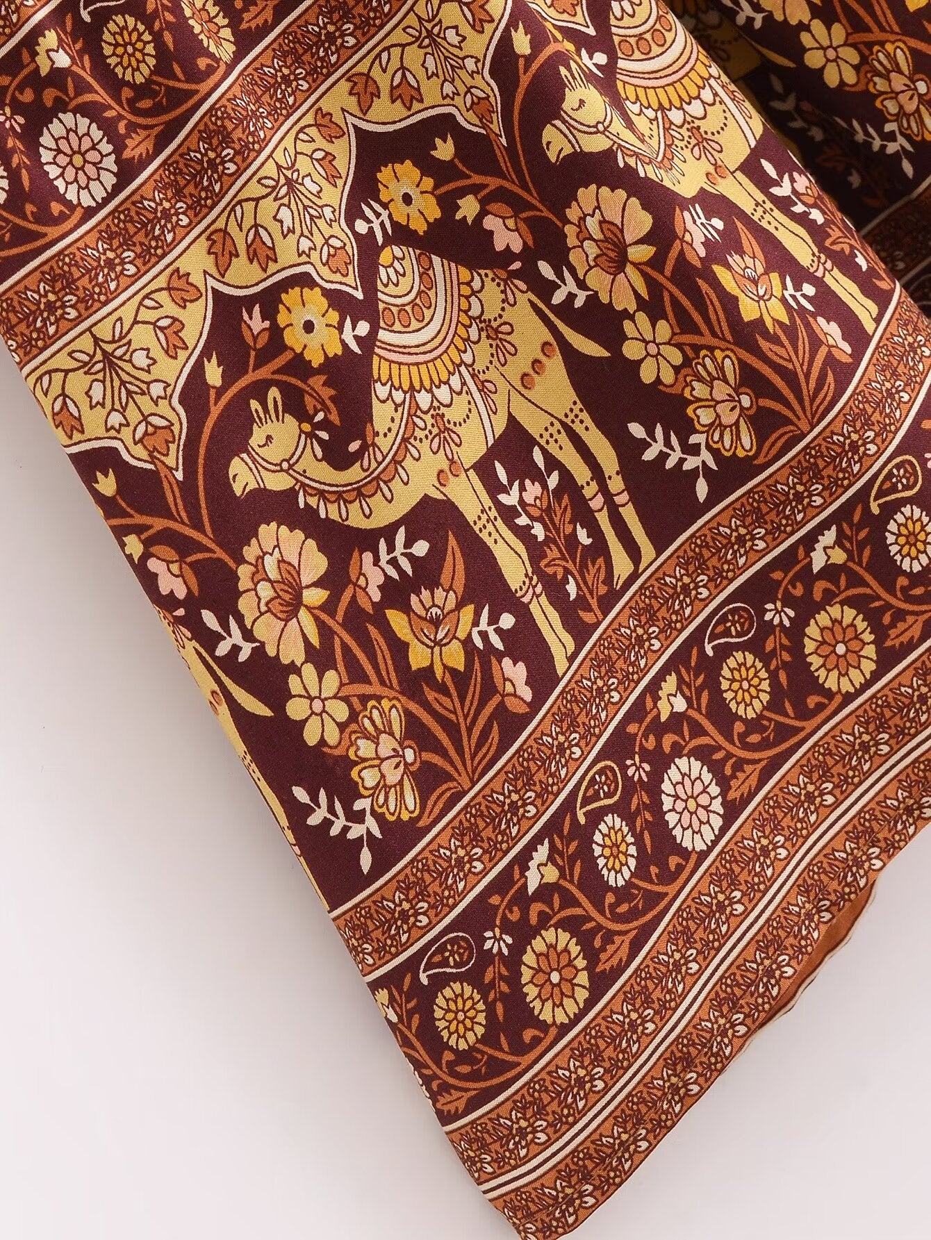 Malbusaat printed rayon maxi dress for women with brown and yellow floral and camel motif design