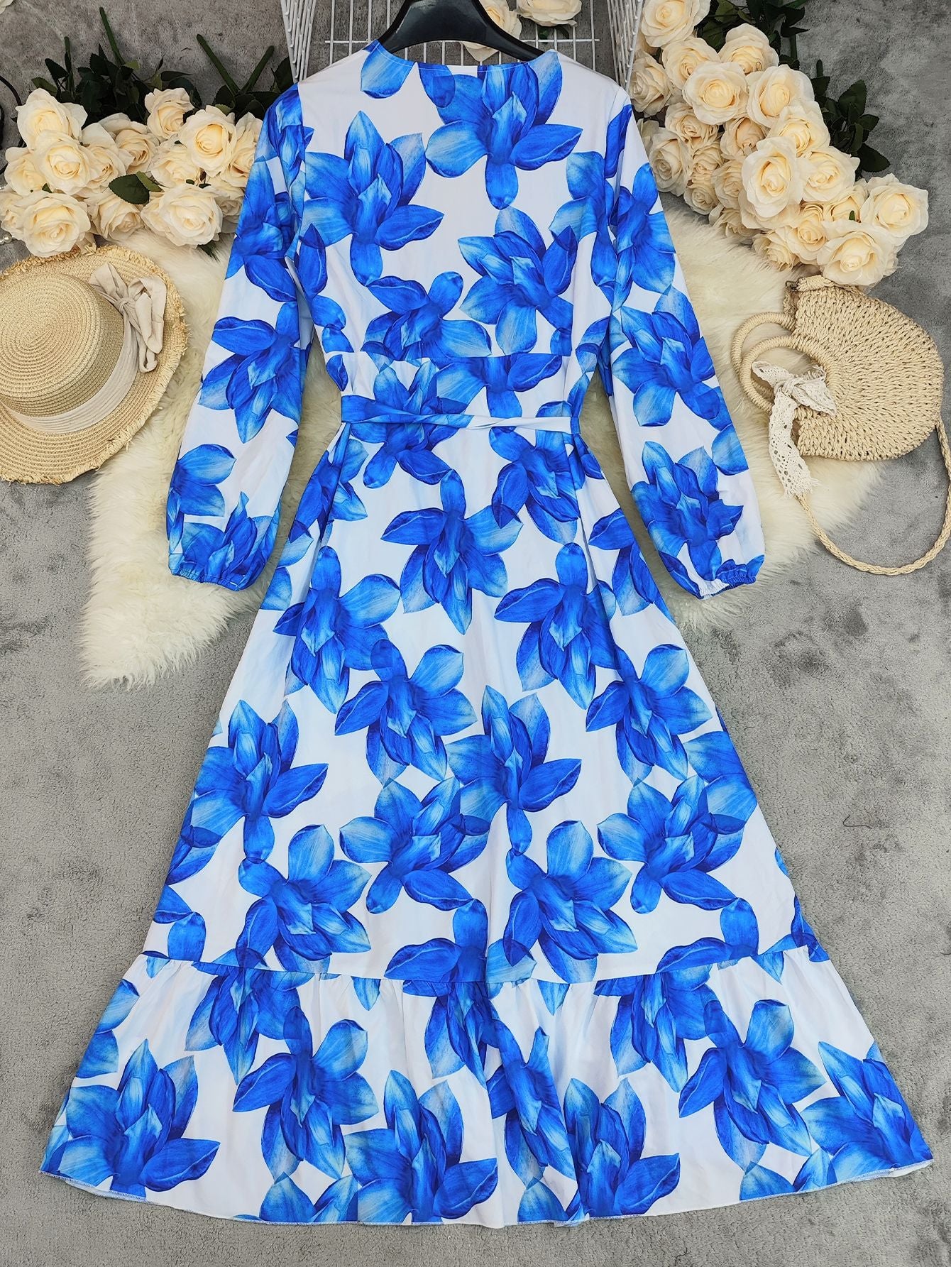 Malbusaat printed v neck tiered dress in vibrant blue floral design, perfect for summer occasions