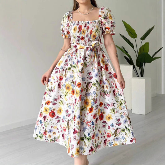 PLAYA puff sleeve floral midi dress with vibrant flowers on a white background, perfect for summer outings