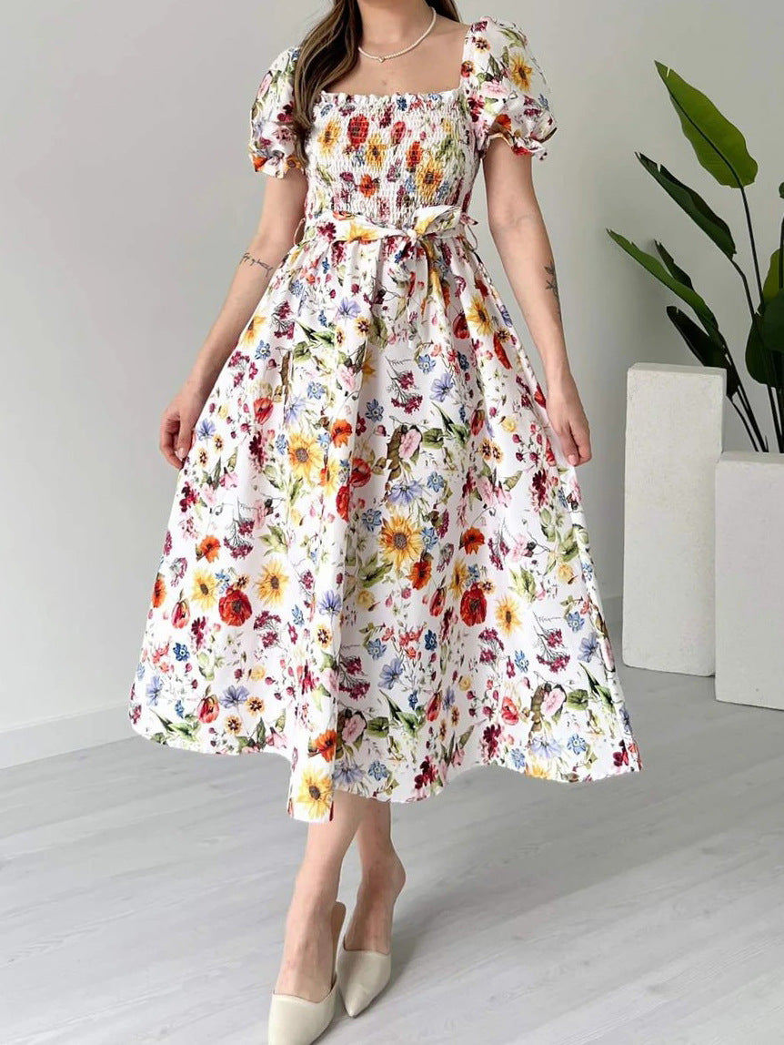 PLAYA puff sleeve floral midi dress with a fitted bodice and flowy skirt, perfect for summer events