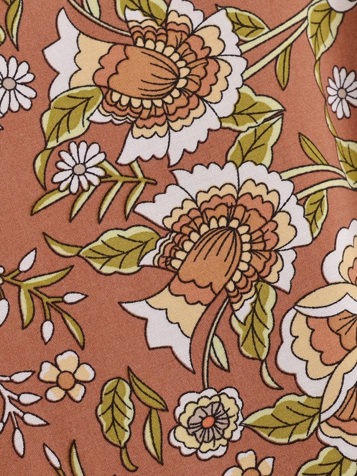 Close-up of floral pattern on Malbusaat rayon printed long sleeve dress in warm earthy tones