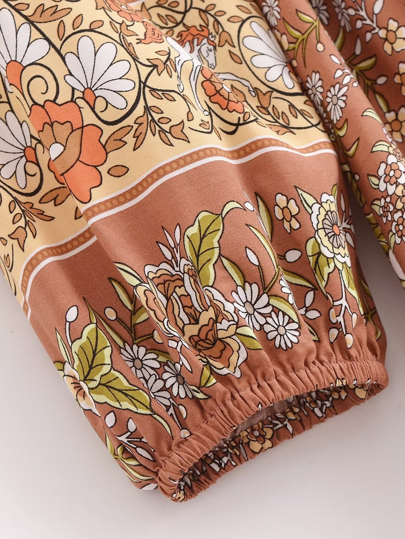 Close-up of floral pattern on Malbusaat rayon printed long sleeve dress with elastic cuff