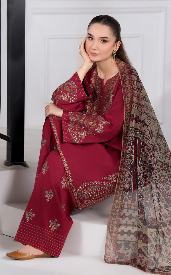 Elegant model wearing a Rich Maroon Embroidered Viscose Suit with intricate designs and matching dupatta