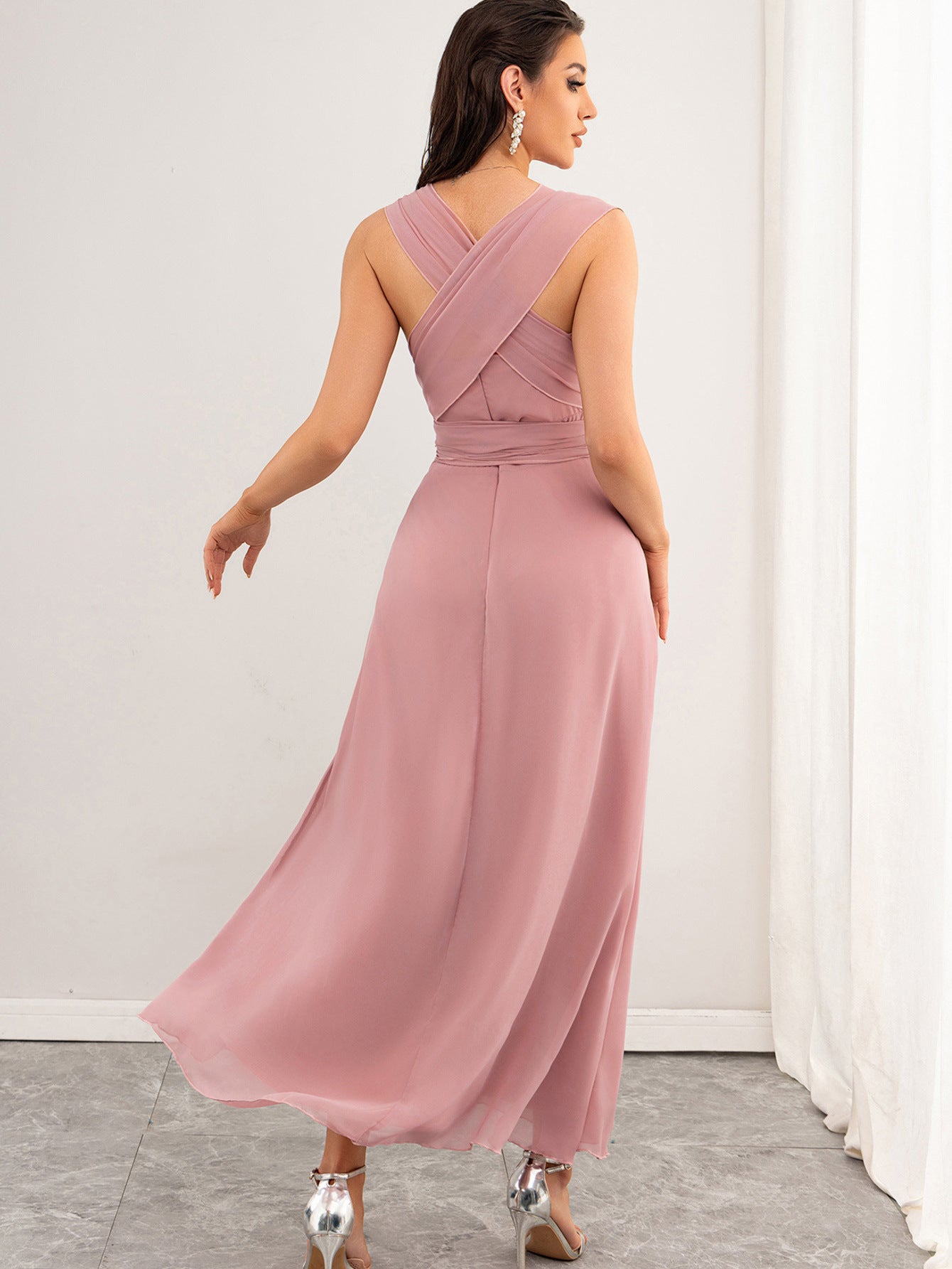 Back view of Malbusaat chiffon pink maxi dress UK with criss cross straps and flowing skirt