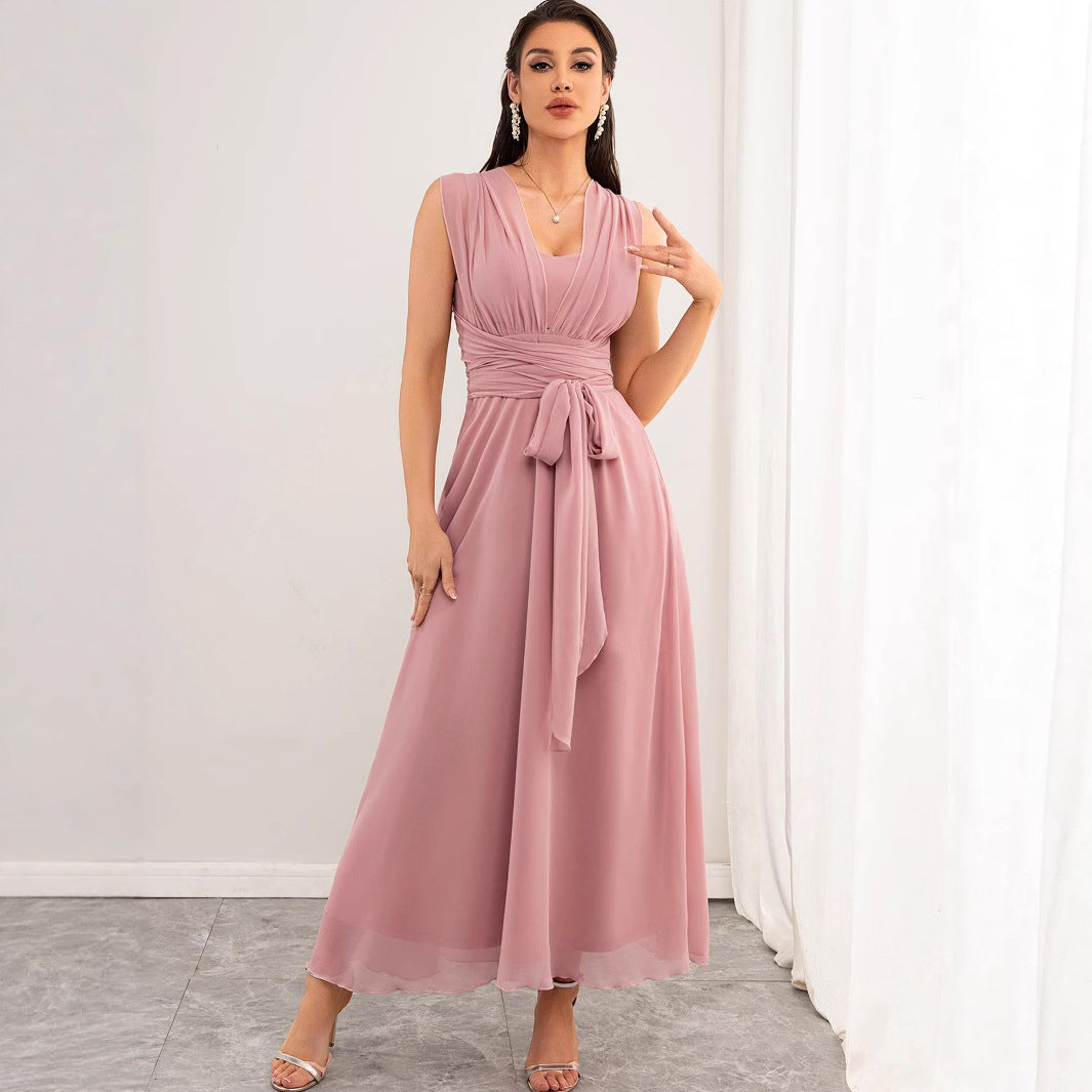 Malbusaat model wearing chiffon pink maxi dress UK sleeveless V neck ruched bodice waist tie floor length