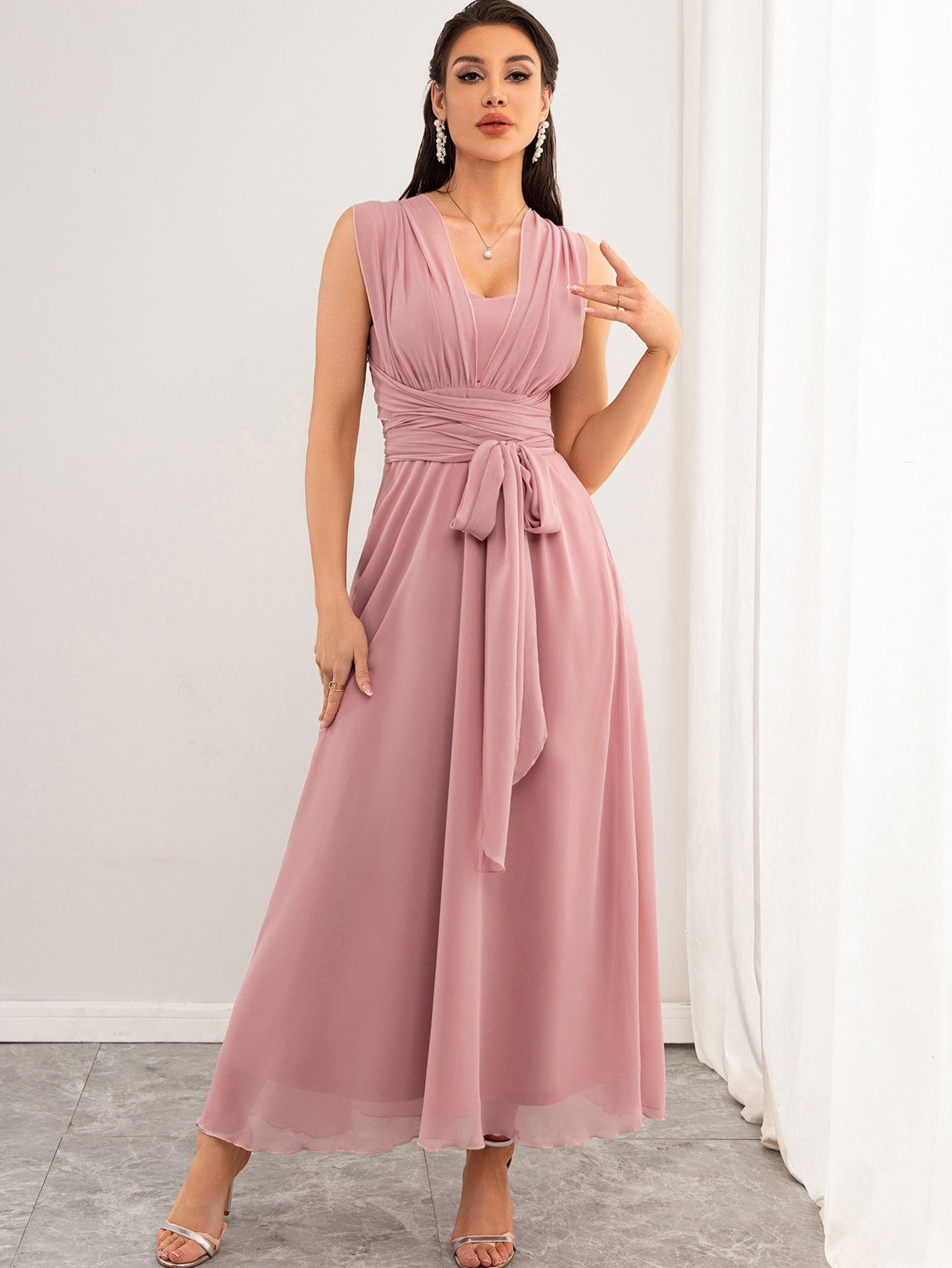 Malbusaat chiffon pink maxi dress UK model wearing sleeveless V neck gown with ruched waist tie and flowing skirt