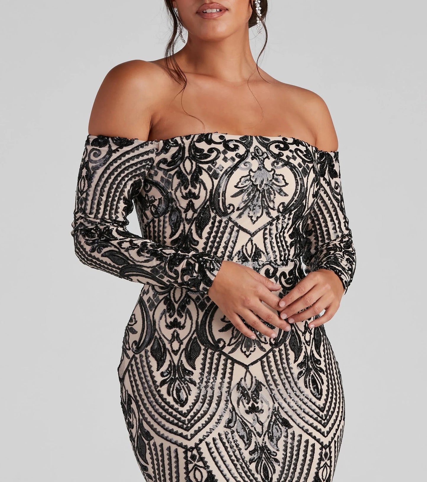 Elegant sequin off shoulder maxi dress in black and beige with intricate detailing and fitted silhouette