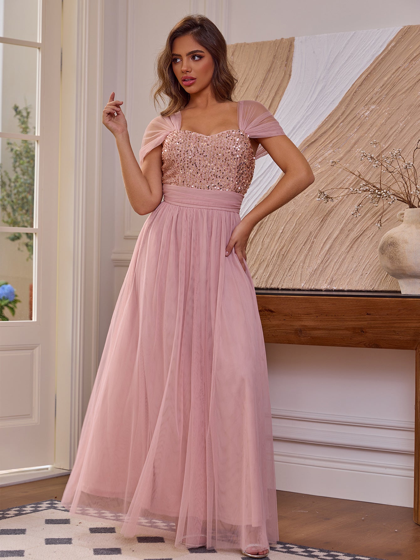 Malbusaat sequined short sleeved dress in soft pink with a flowing tulle skirt and fitted bodice