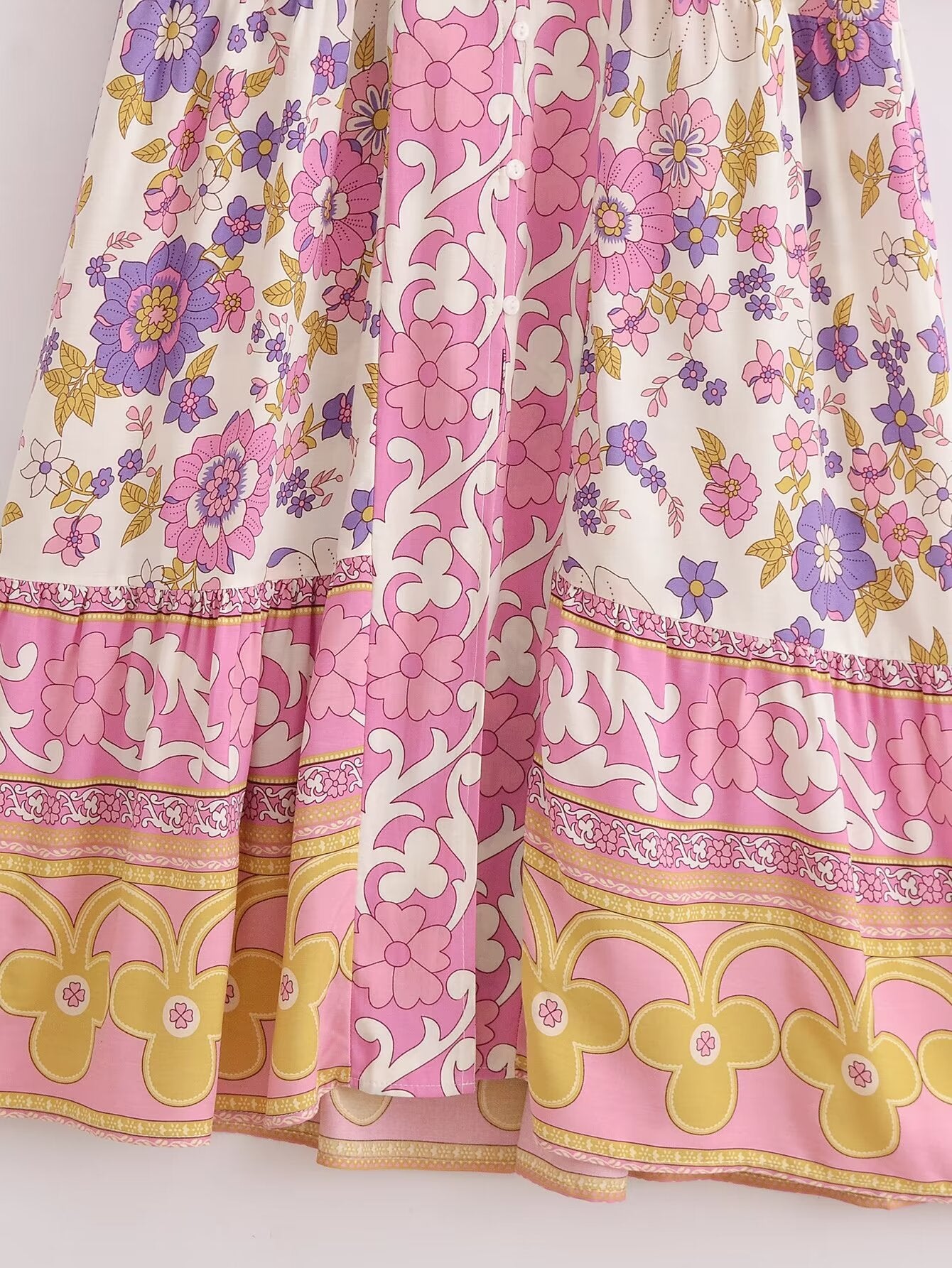 Close-up of Malbusaat spring floral midi dress for women featuring pink purple and yellow floral patterns