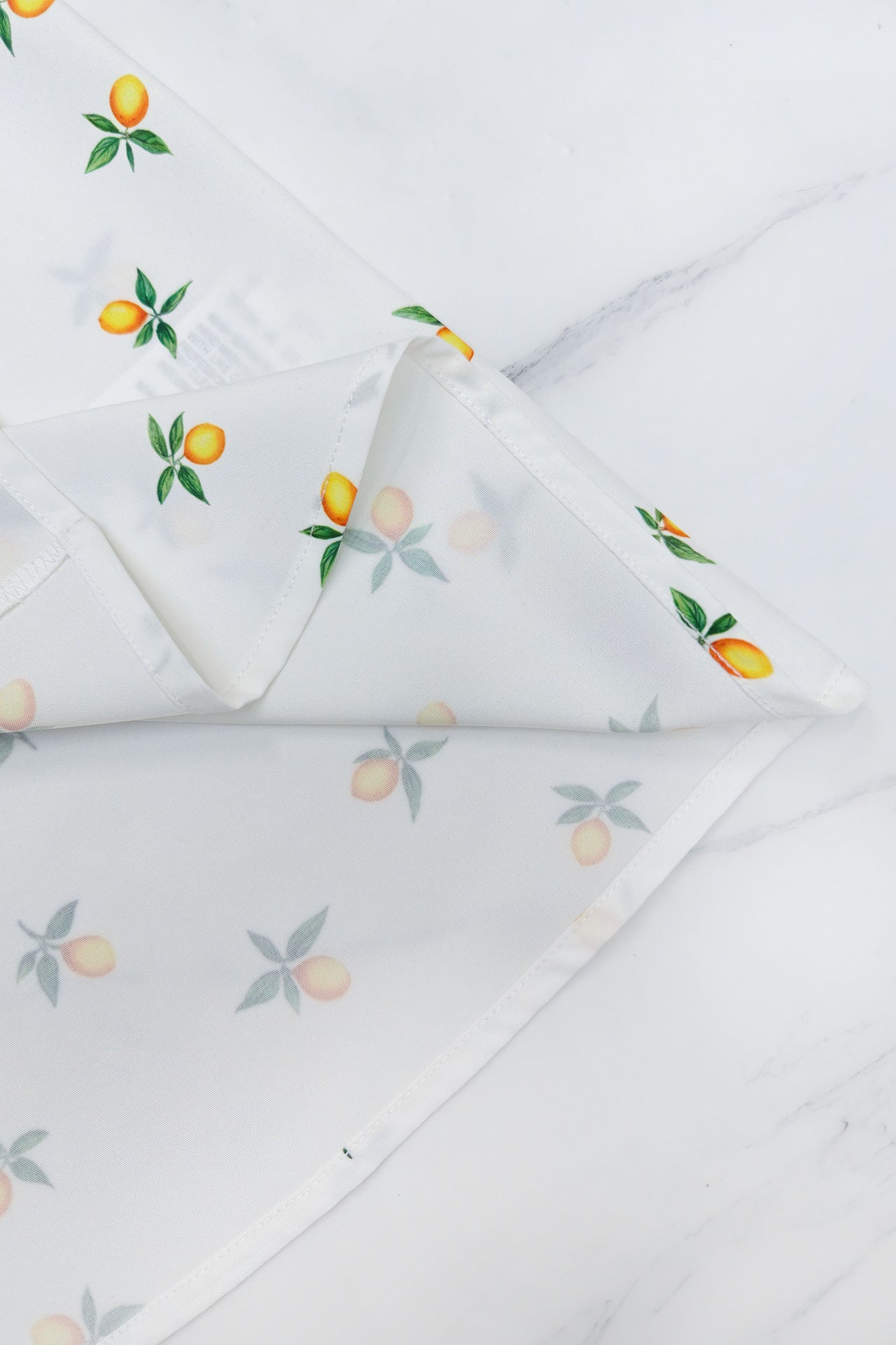 White square neck holiday midi dress with lemon print and floral design for a stylish look