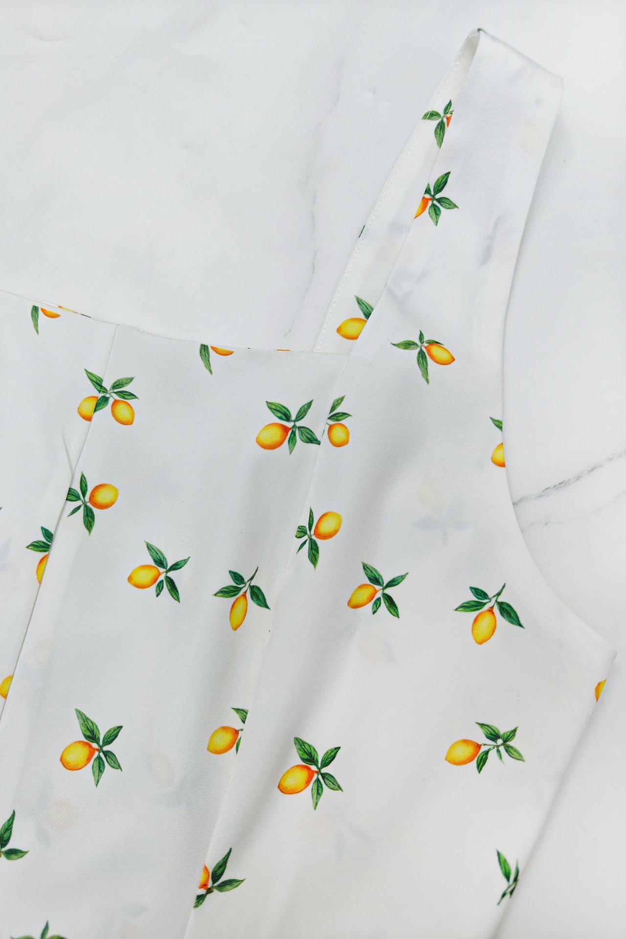 Malbusaat square neck holiday midi dress featuring a lemon print design on a white background