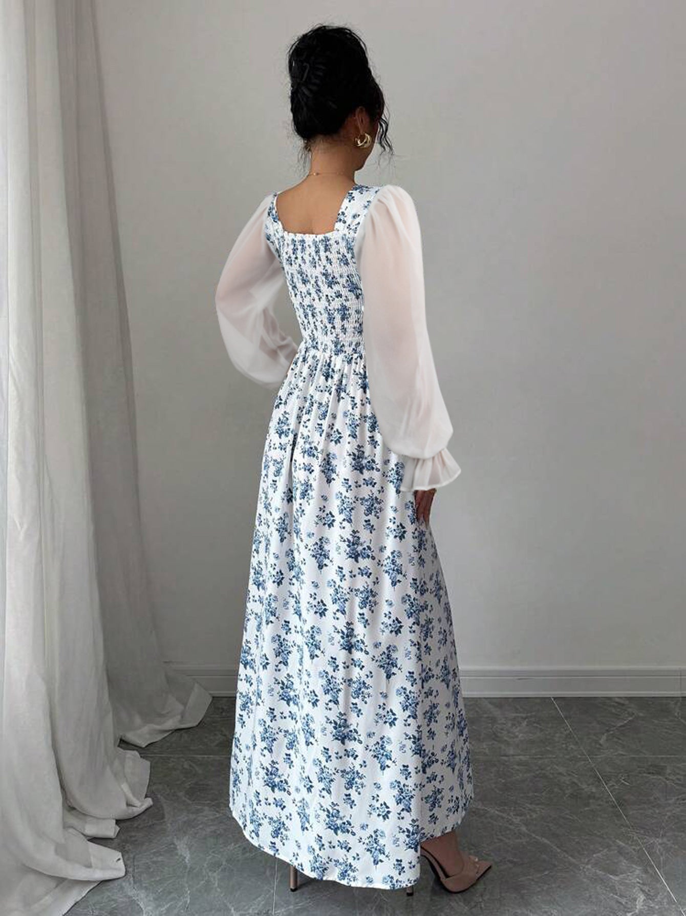 Floral print square neck swing dress by Malbusaat with puffed sleeves and a flowing design