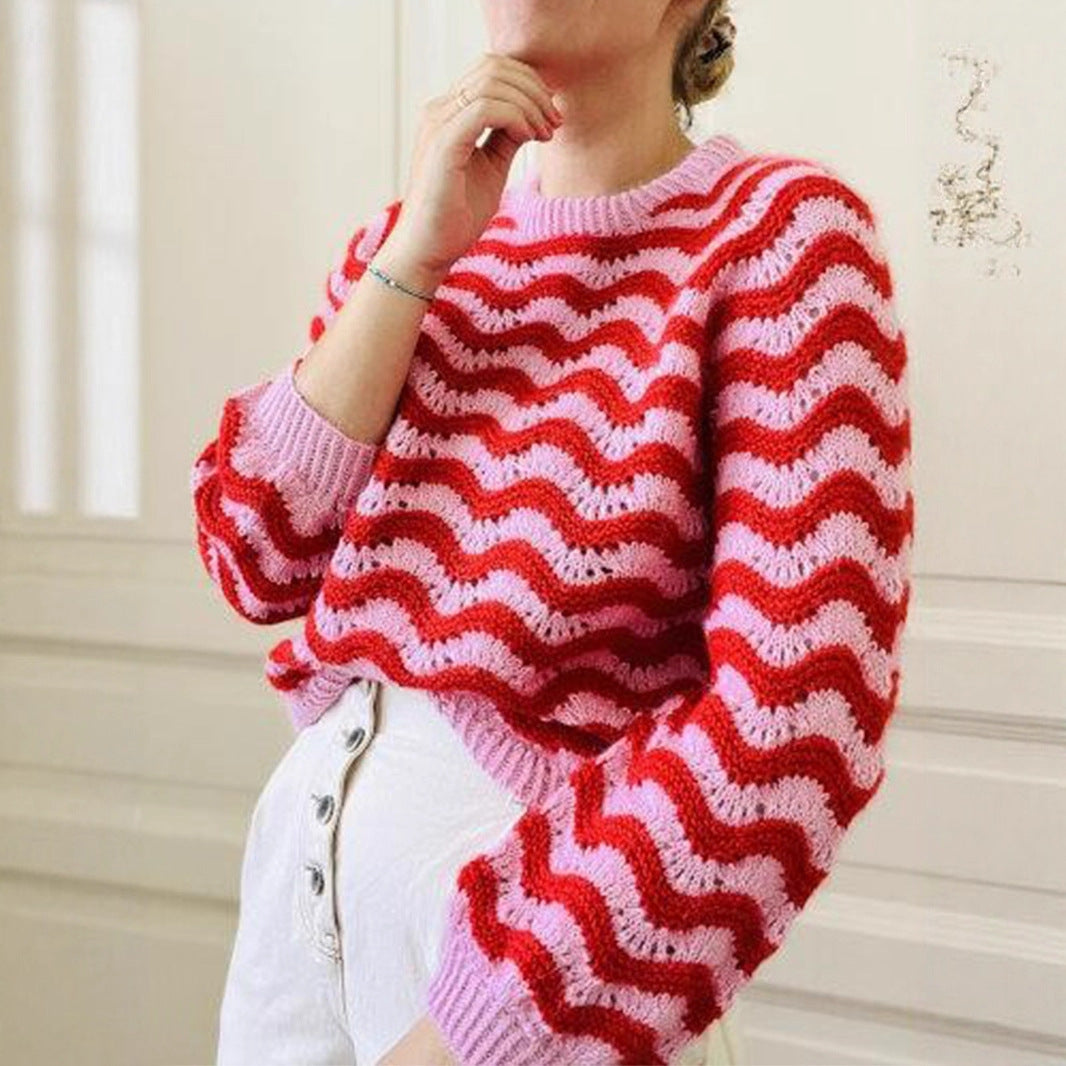 Striped knit sweater for women in pink and red with wavy pattern and ribbed cuffs by Malbusaat
