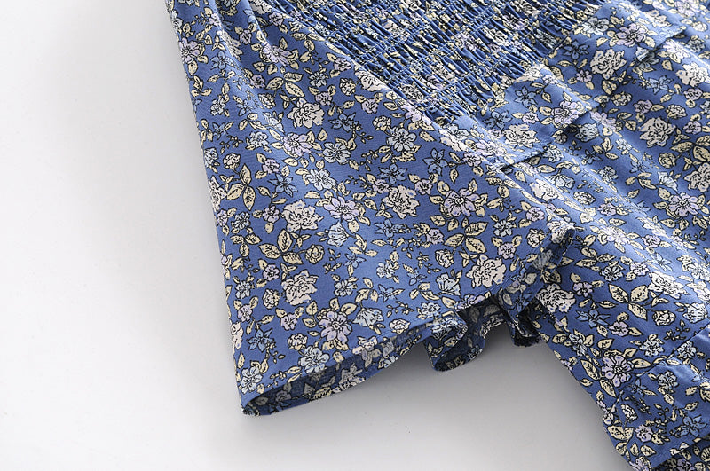 Blue floral summer maxi dress for women by Malbusaat with smocked bodice and short sleeves
