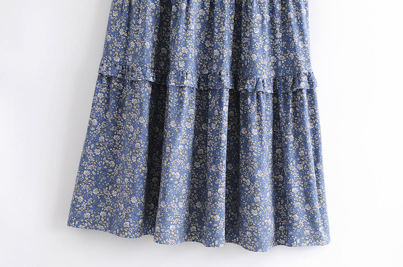 Blue floral summer maxi dress for women by Malbusaat with ruffle detailing on hem