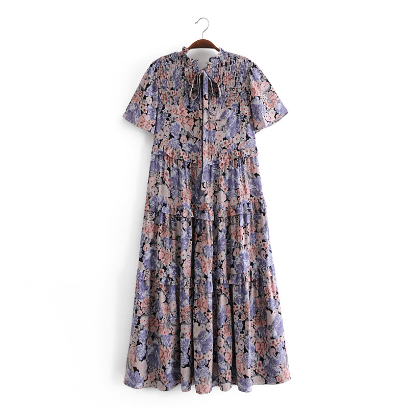Malbusaat summer maxi dress for women with floral pattern and short sleeves hanging on wooden hanger