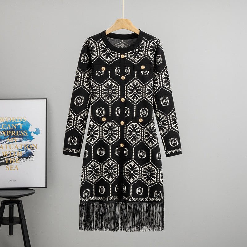 Malbusaat tassel button knit dress in black with intricate white patterns and fringe detail