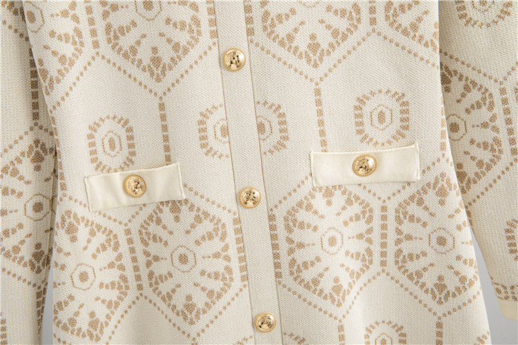 Close-up of Malbusaat tassel button knit dress featuring decorative button details and intricate pattern