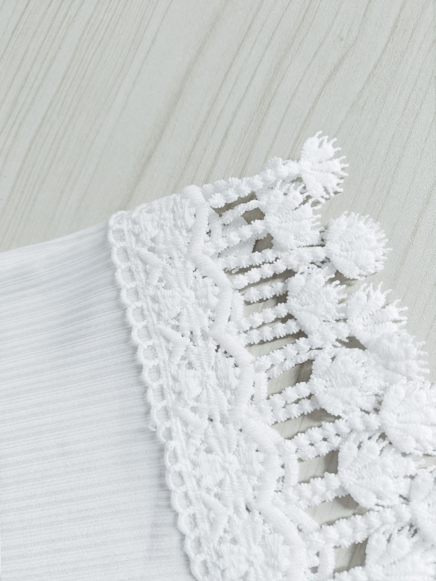 White tassel lace beach shorts with intricate lace detailing for a stylish summer look
