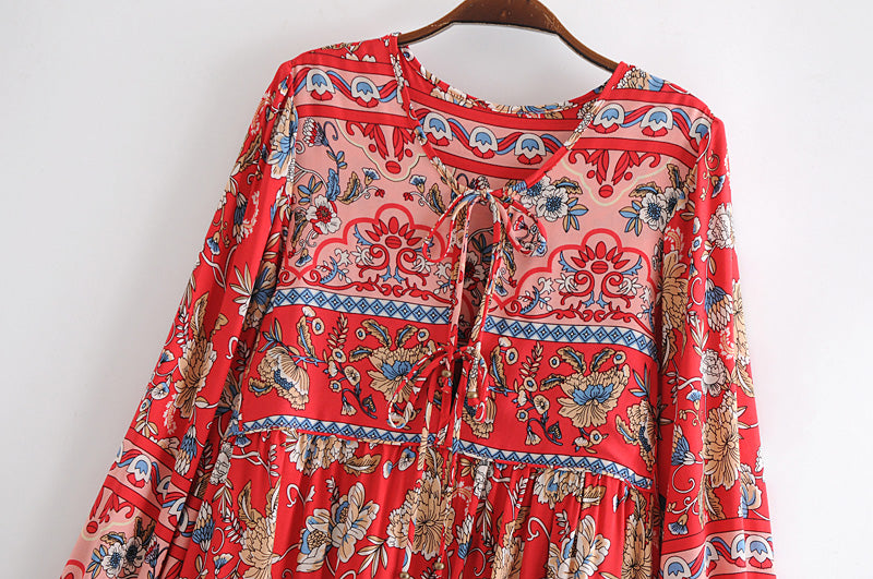 Red and blue patterned long sleeve floral dress for women by Malbusaat with ties at the neckline
