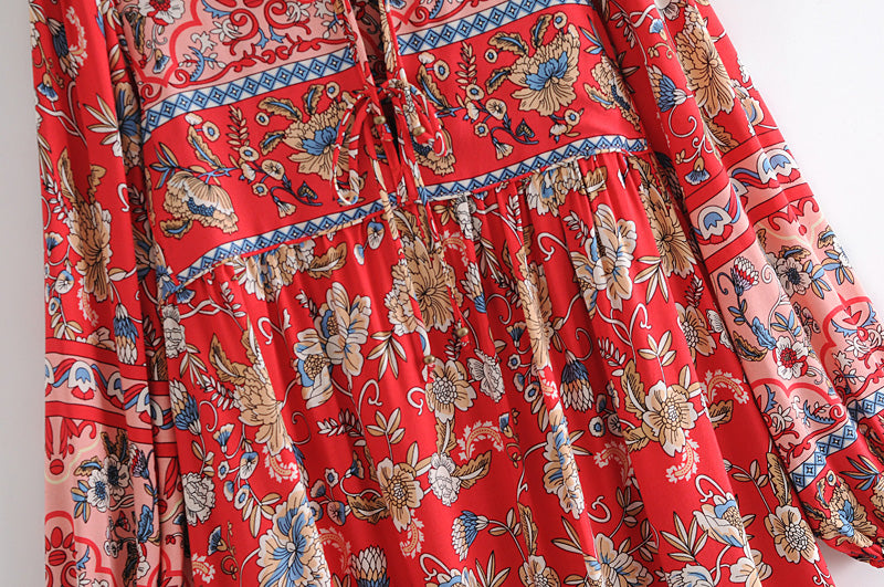 Red long sleeve floral dress for women by Malbusaat featuring intricate flower patterns and detailed stitching