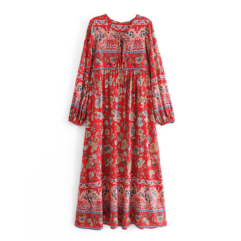 Red long sleeve floral dress for women featuring a bohemian print and tie neckline by Malbusaat
