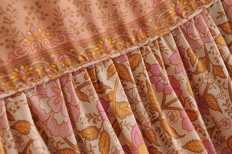 Close-up of floral printed fabric detail on Malbusaat long sleeve rayon tassel dress