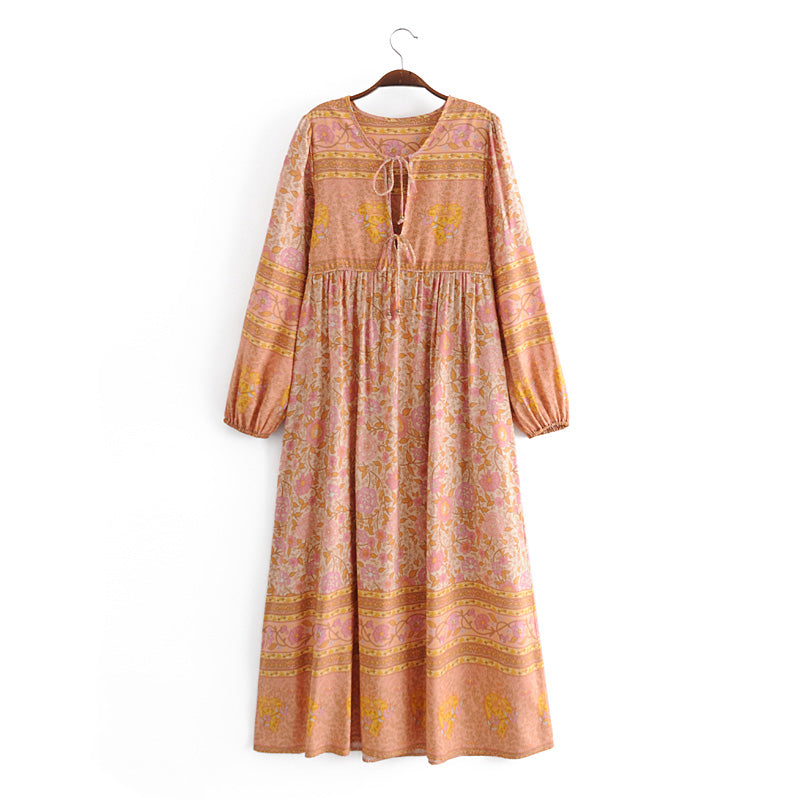 Malbusaat long sleeve rayon tassel dress with floral print and gathered waist in pink and mustard tones