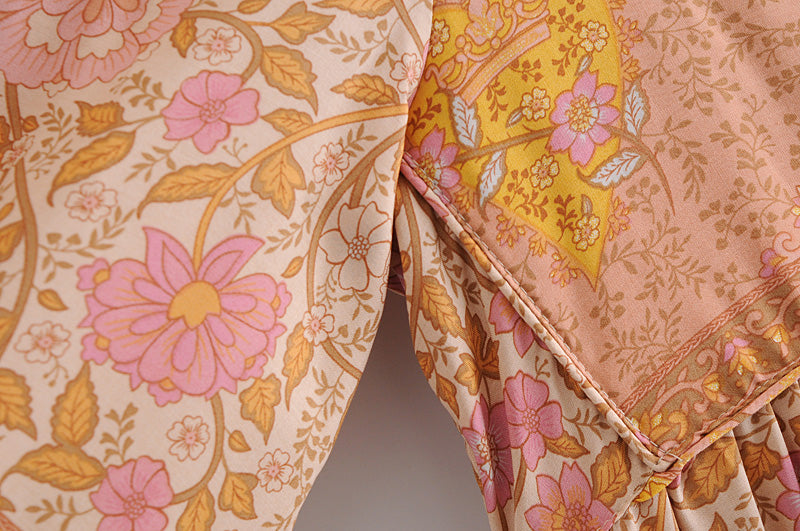 Close-up of floral patterned long sleeve rayon tassel dress fabric by Malbusaat in soft pink and yellow tones