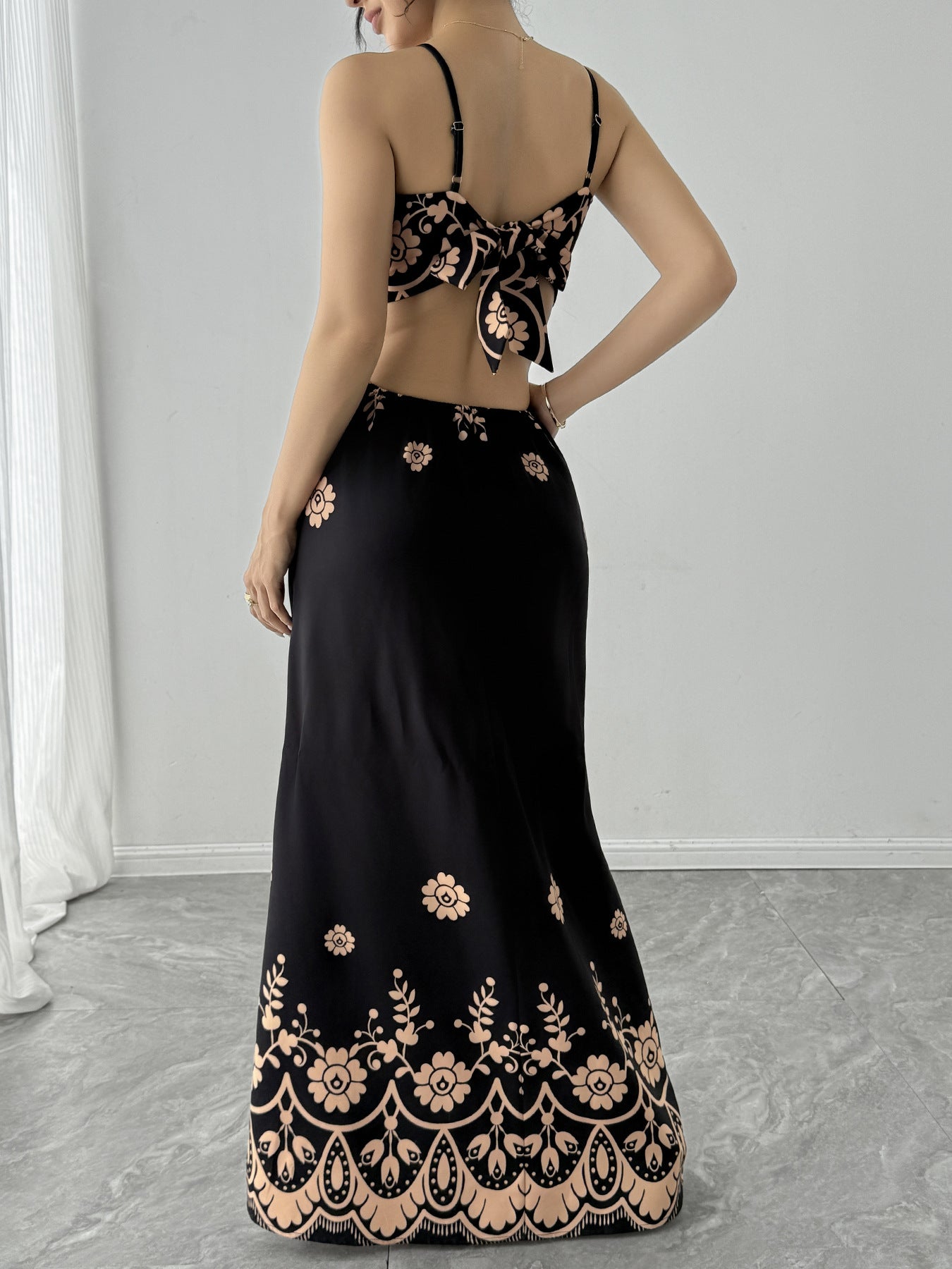 Elegant vintage strap printed maxi dress in black with floral patterns for a stylish summer look