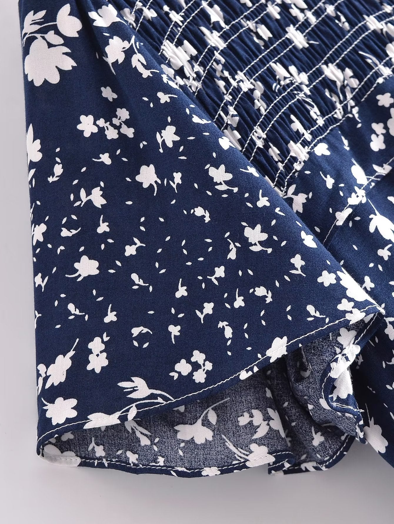 Malbusaat women's summer floral dress in navy blue with white floral print and smocked detailing