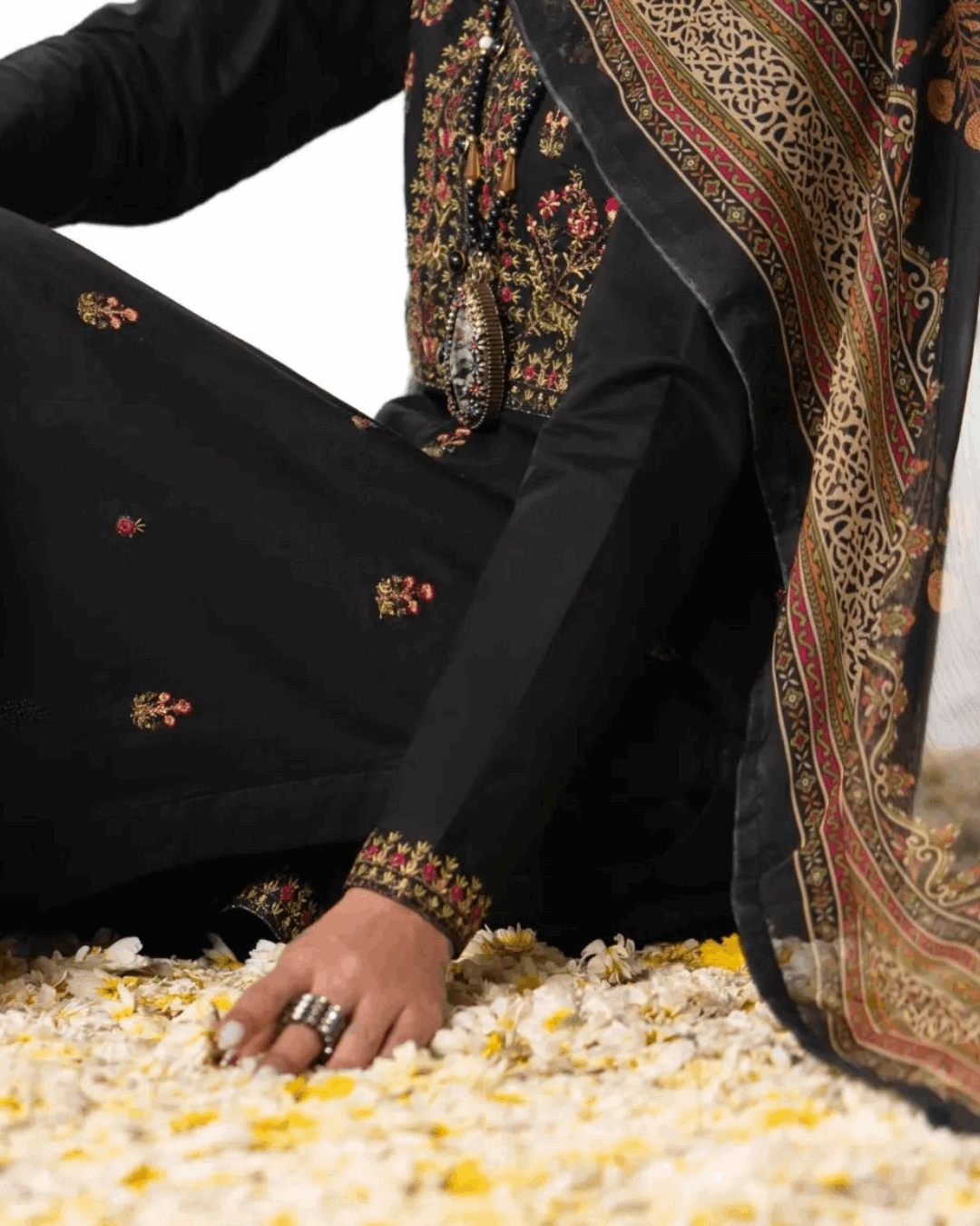 Shop Elegant Black Traditional Suit with Floral Detailing by Malbusaat, versatile Pakistani Dresses at Malbusaat. Ready-made desi suits, Pakistani designer dresses online UK.