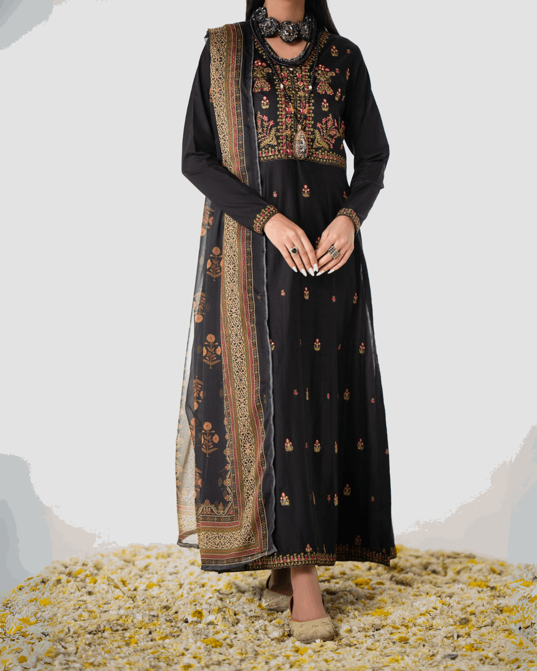 Shop Elegant Black Traditional Suit with Floral Detailing by Malbusaat, versatile Pakistani Dresses at Malbusaat. Ready-made desi suits, Pakistani designer dresses online UK.