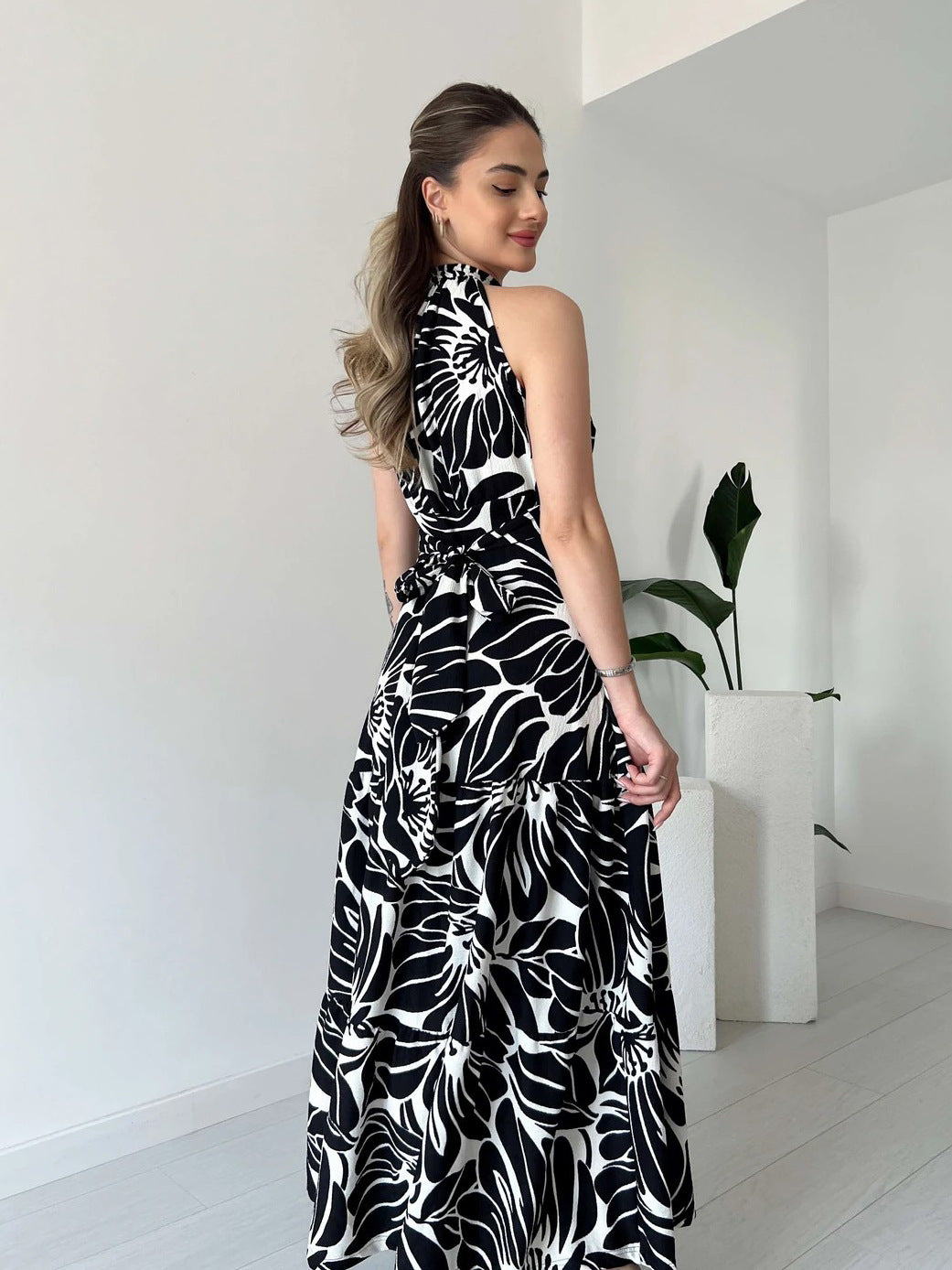 Shop Sleeveless Floral Maxi Dress with High Slit and Mock Neck by Malbusaat, versatile  at Malbusaat. Ready-made desi suits, Pakistani designer dresses online UK.