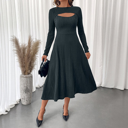 Black autumn slim fit midi dress with long sleeves and cutout detail styled with black heels and handbag