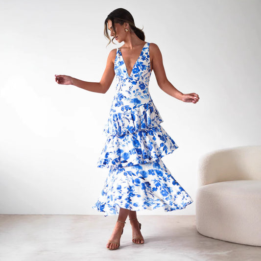 Woman wearing a blue and white floral Backless Deep V Plunge Summer Vacation Maxi dress by Malbusaat