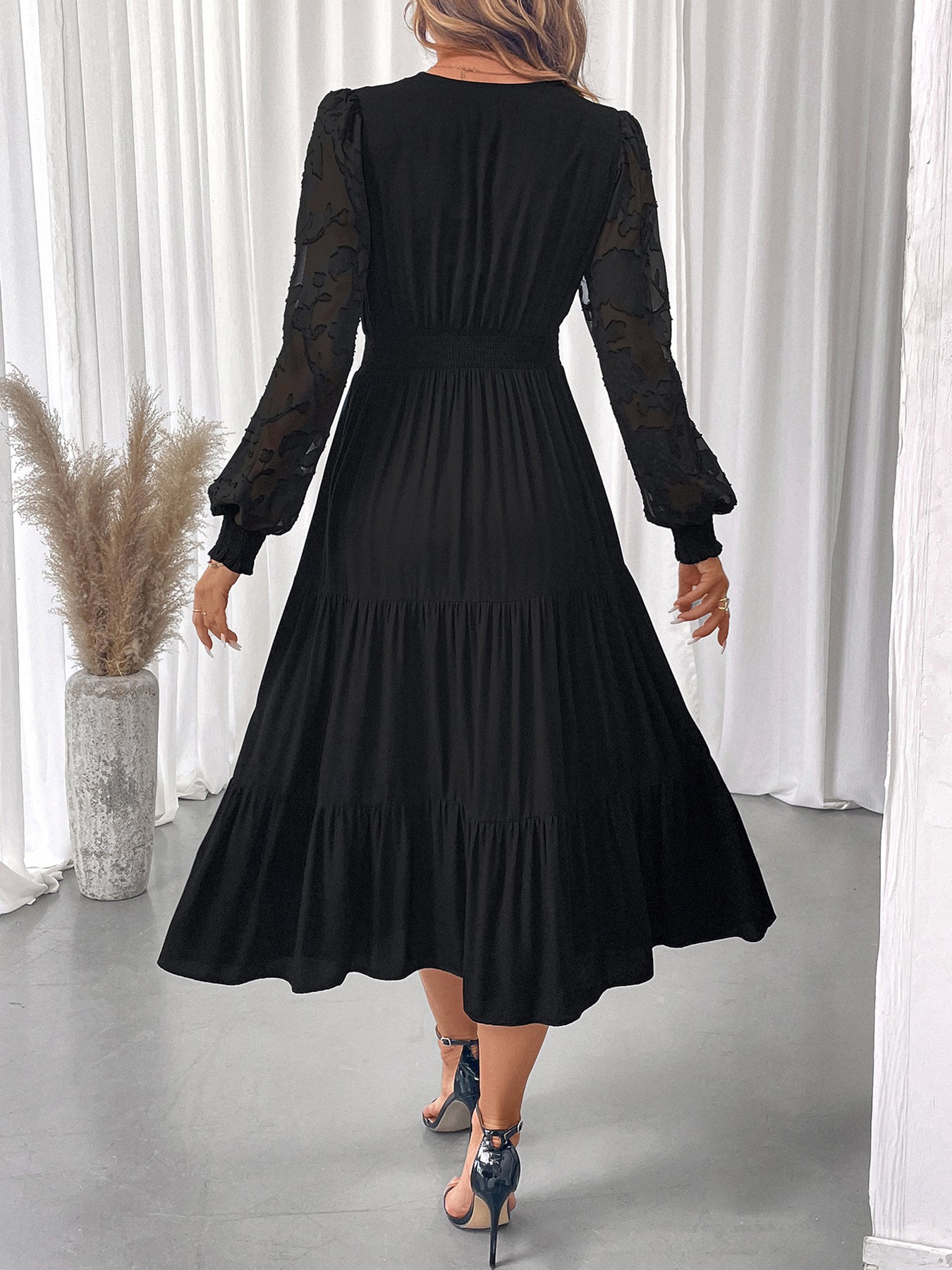 Black elegant lace long sleeve dress with sheer lace sleeves and tiered skirt by Malbusaat